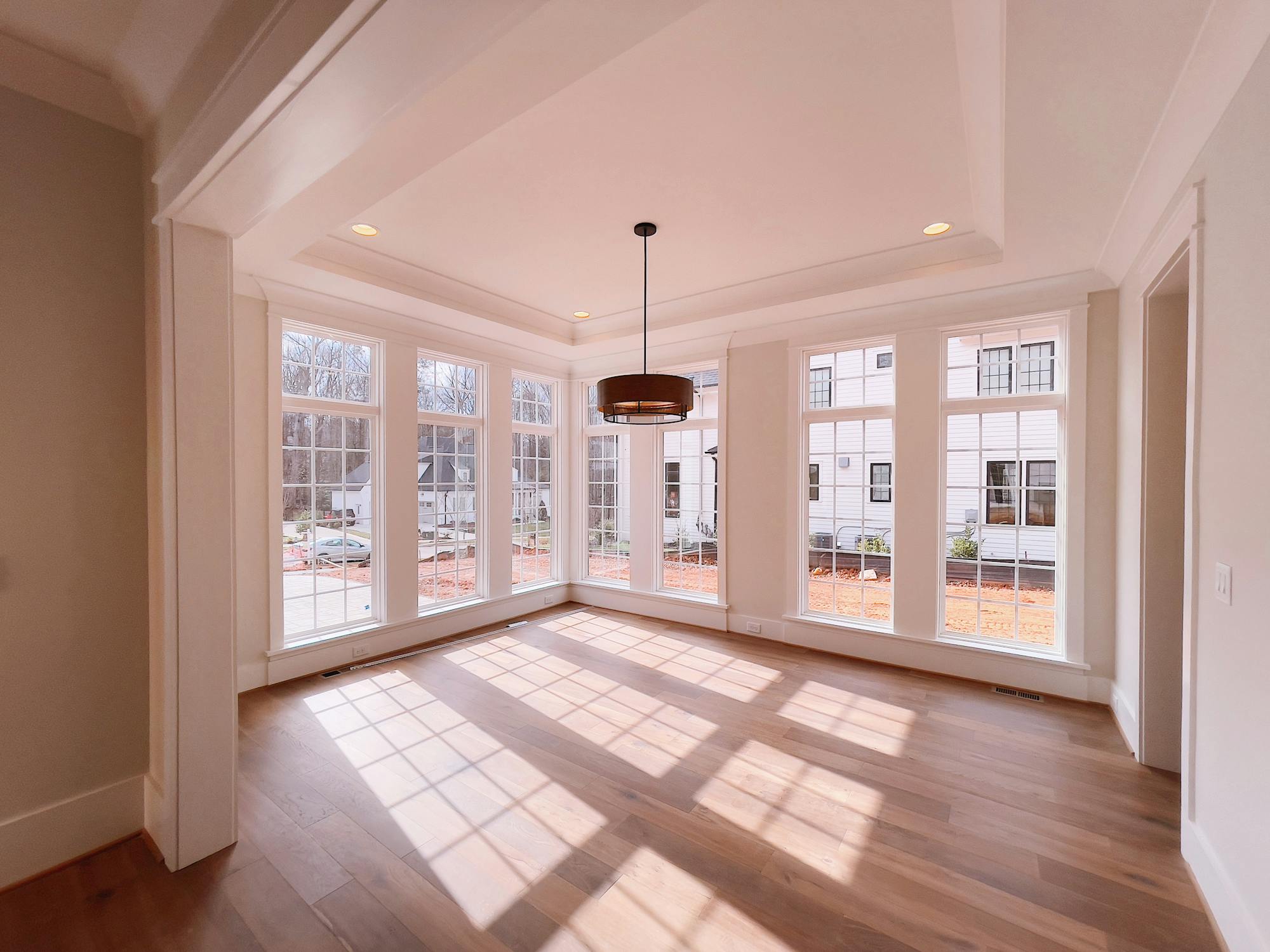 Newly completed empty residential interior with hardwood floors