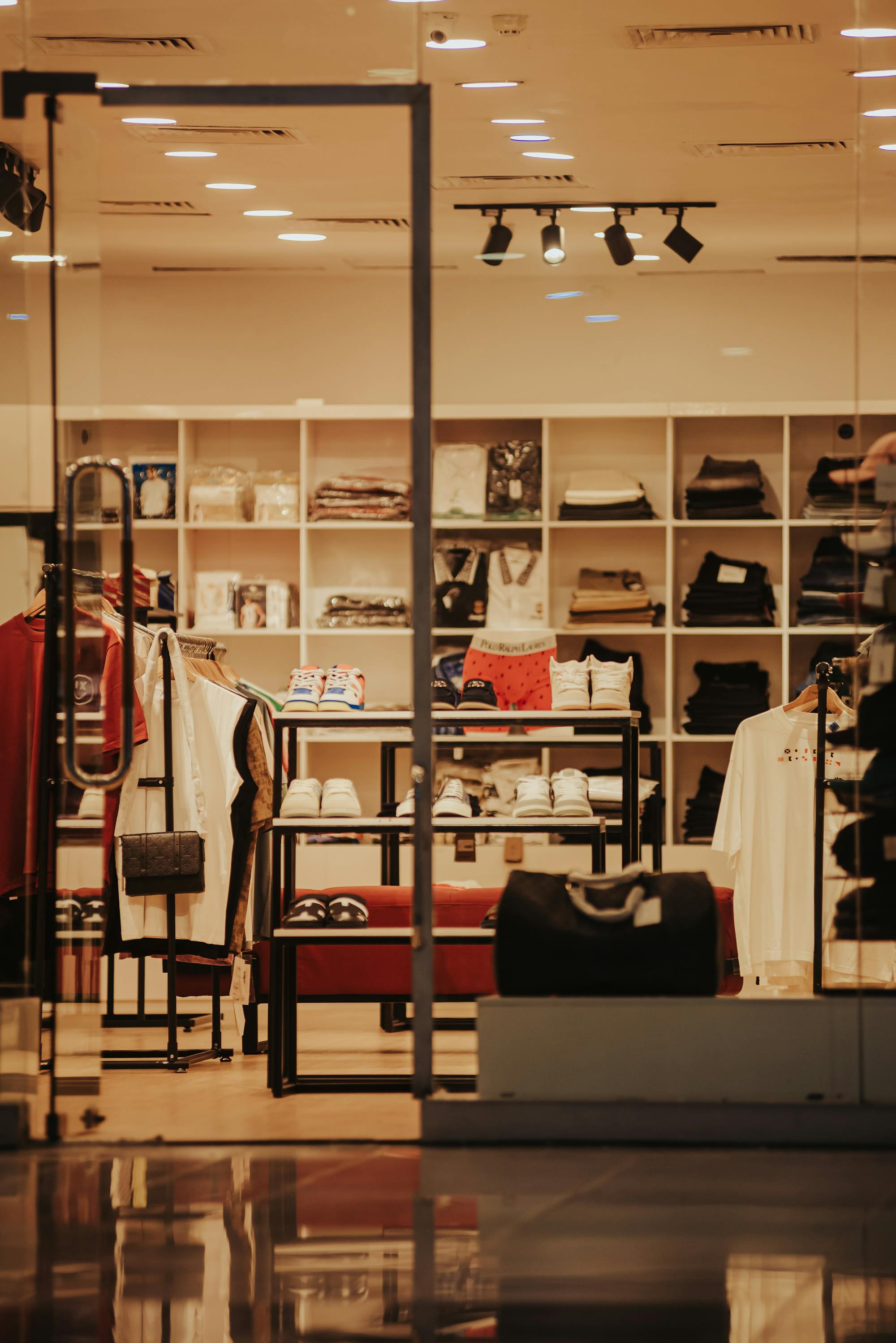 Modern empty clothing store interior with displays